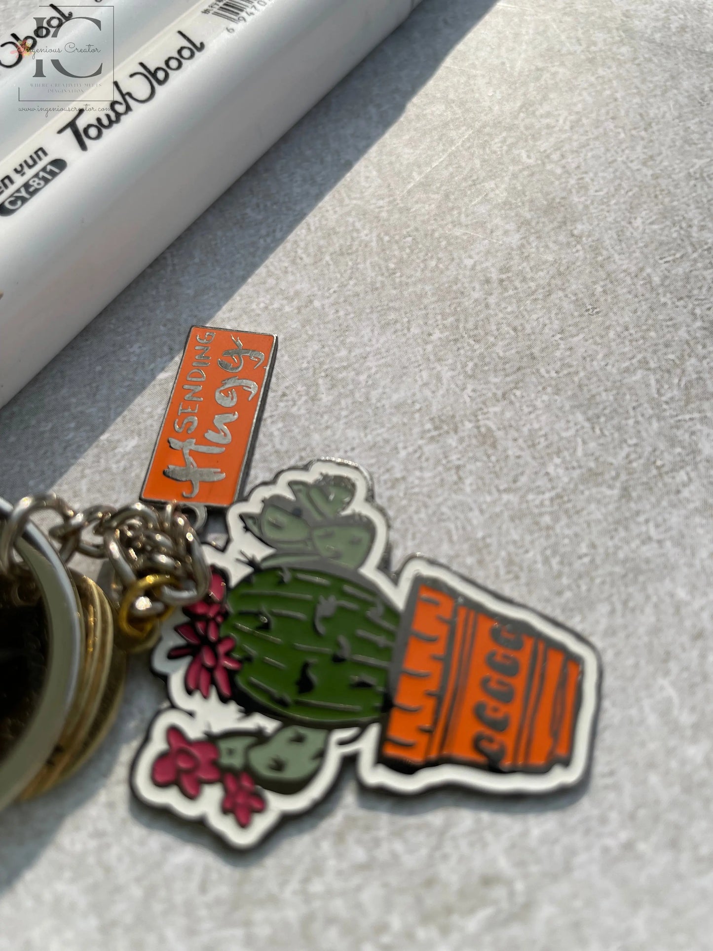 Sending Huggs Enamel Keychain - Ingenious Creator's Store